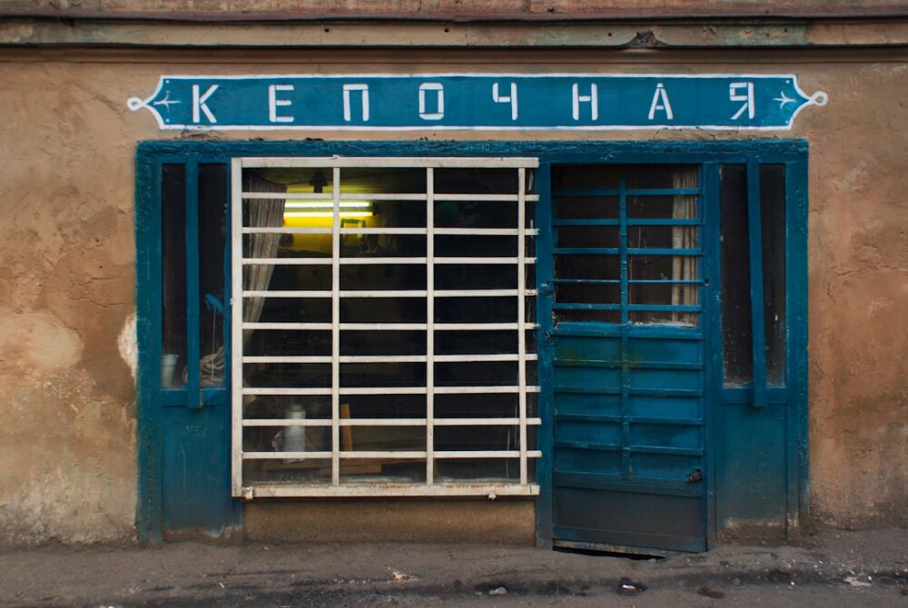 blue metal door with glass panel