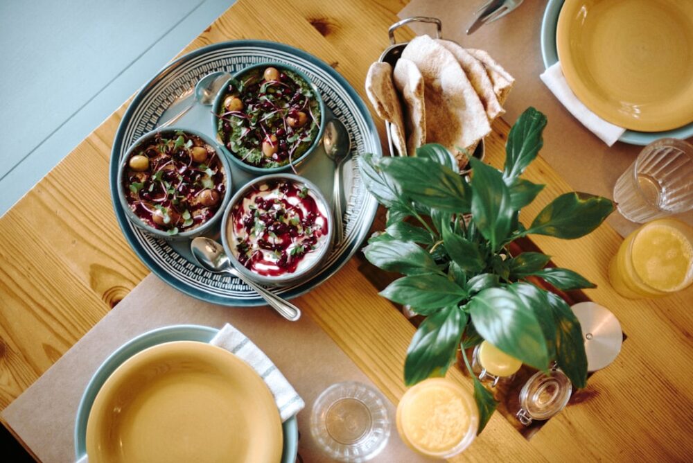 Delicious food is served on a wooden table.