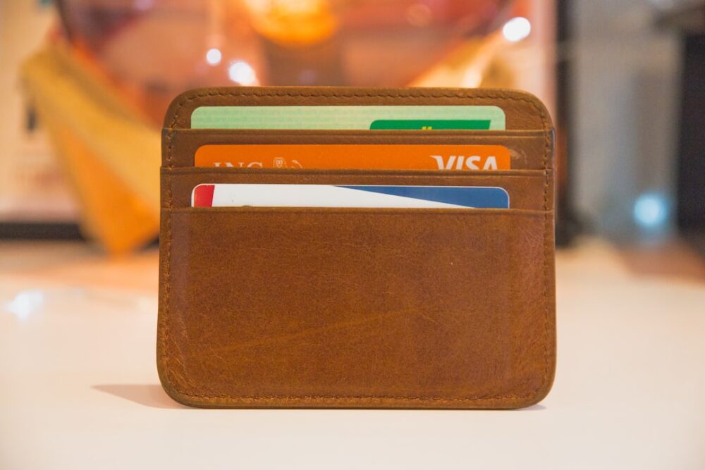 students wallet four credit cards lined up