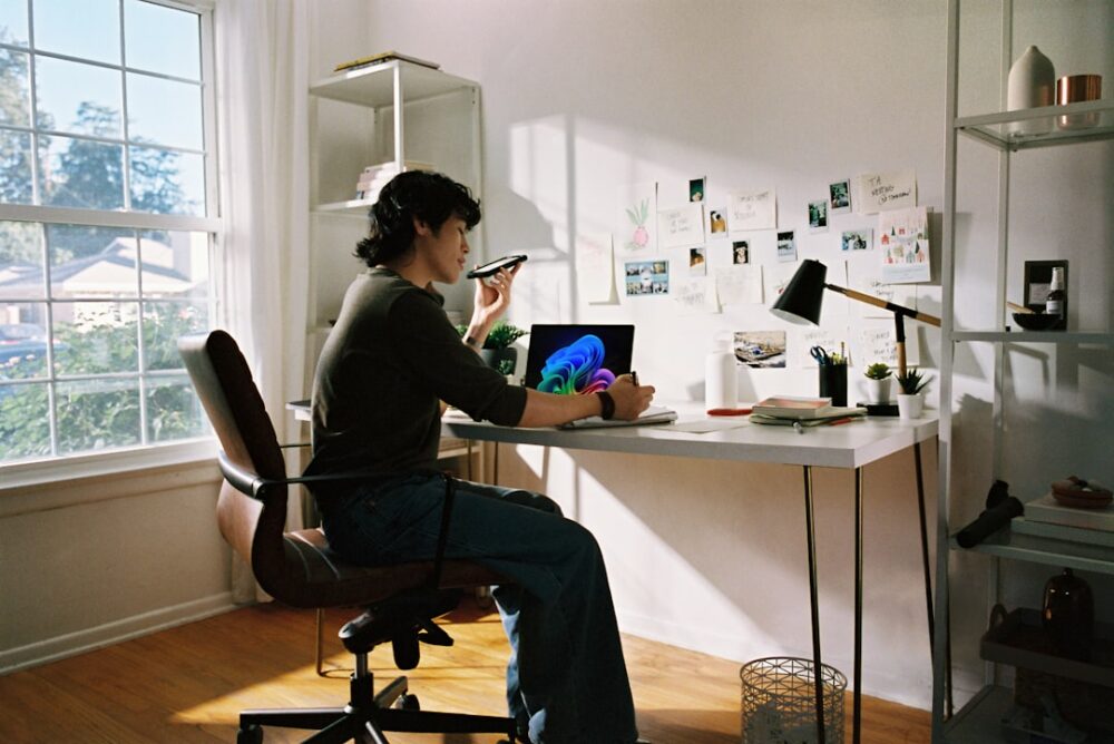 freelancer working laptop home office desk